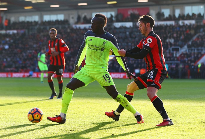 Liverpool winger Sadio Mané (middle) against Bournemouth defenders.