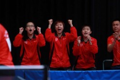 (From L-R) Wong Chin-yau, Minnie So, Mak Tze-wing and coach Li Ching cheer on Liu Qi in the team event at the junior World Championships in Cape Town.