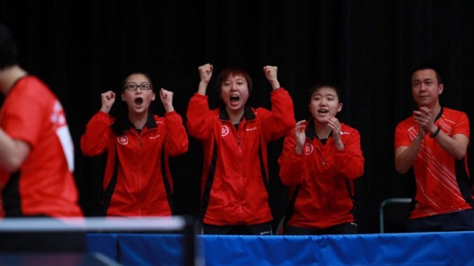 (From L-R) Wong Chin-yau, Minnie So, Mak Tze-wing and coach Li Ching cheer on Liu Qi in the team event at the junior World Championships in Cape Town.