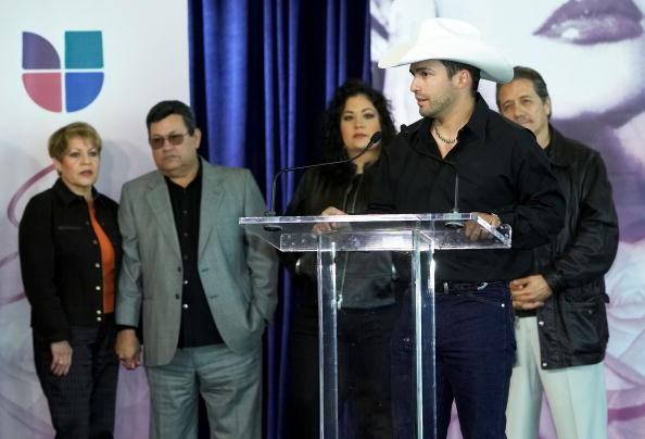 Marcela, Abraham, and Suzette Quintanilla along with actor Edward James Olmos (L-R) listen as Tejano music artist Bobby Pulido speaks during the 'Selena ?Vive!' press conference February 3, 2005 in Houston, Texas.   