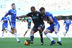 West Brom striker Salomon Rondon (middle) competes for the ball against Chelsea's Gary Cahill.