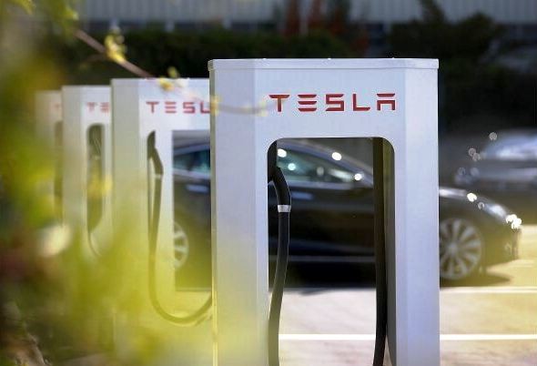 A row of new Tesla Superchargers are seen outside of the Tesla Factory on August 16, 2013 in Fremont, California. Tesla Motors opened a new Supercharger station with four stalls for public use at their factory in Fremont, California