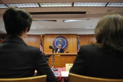 Federal Communications Commission (FCC) Chairman Tom Wheeler speaks as audience watch