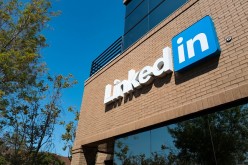 The sign and logo of LinkedIn seen at the entrance of office