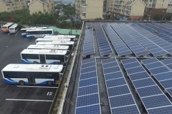Buses are parked in a parking building powered by solar energy in Shanghai.