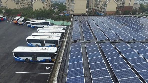 Buses are parked in a parking building powered by solar energy in Shanghai.