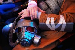 A 'Fallout' cosplay fan holds a mask as he attends the Bethesda E3 2015 press conference at the Dolby Theatre on June 14, 2015 in Los Angeles, California. 