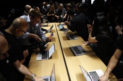 Press members attend an Apple event showcasing the tech company's new products.