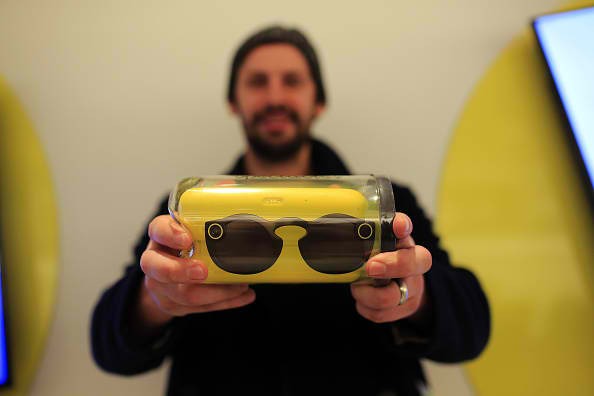 A customer shows a pair of Snapchat Spectacles, a pair of camera-equipped sunglasses made by Snapchat Inc.