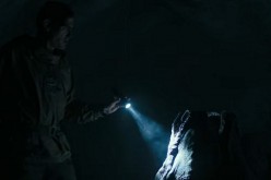 Screenshot of the Covenant crew facing the Neomorph face-hugger in the official trailer for 'Alien: Covenant.'