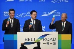 Hong Kong Chief Executive Leung Chun-ying (L), Zhang Dejiang (C) and former Hong Kong chief executive Tung Chee-hwa (R) open the Belt and Road Summit in Hong Kong on May 18, 2016.