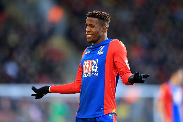 Crystal Palace attacker Wilfred Zaha complains to a linesman during a match against Watford in the Premier League.