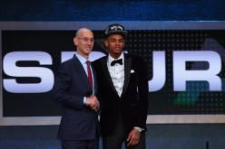 Adam Silver (L) poses for a photo with Dejounte Murray (R) after Murray was selected by the San Antonio Spurs in the first round of the 2016 NBA Draft.
