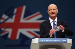Minister of State for Universities and Science, David Willetts, holds a 'raspberry pi' computer as he delivers his speech in the main hall on the second day of the Conservative Party Conference on September 30, 2013 in Manchester, England.
