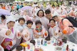 Chinese visitors attend event of samgyetang tasting as South Koreas capital Seoul is bustling with a huge group of tasting samgyetang in Seoul, South Korea on May 6, 2016.