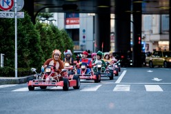 Participants drive around Tokyo in 'Mario Kart' characters for the Real Mario Kart event in Tokyo on November 16, 2014 in Tokyo, Japan.