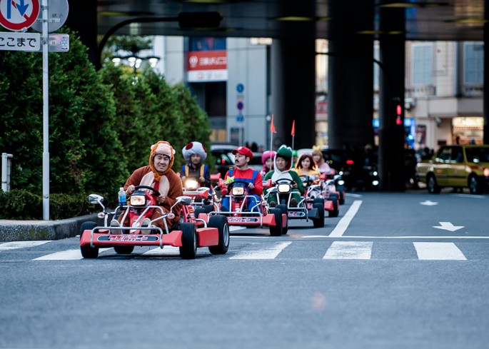 Participants drive around Tokyo in 'Mario Kart' characters for the Real Mario Kart event in Tokyo on November 16, 2014 in Tokyo, Japan.