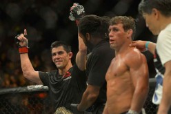 Dominick Cruz gets his arm raised by referee Herb Dean after he beat Uriah Faber in their bantamweight championship match held at UFC 199 last June 4, 2016.