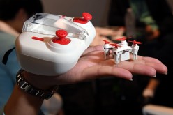 The H001 Nano Q4 SE remote control quadcopter by Hubsan is displayed next to its controller that doubles as the unit's carrying case at InterDrone.