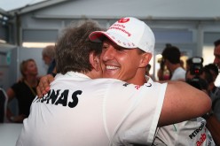 Michael Schumacher embraces Mercedes Motorsport President Norbert Haug after announcing his retirement.
