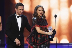 Natalie Portman accepts the award for Best Actress for 'Jackie' from Jeremy Renner onstage during the 22nd Annual Critics' Choice Awards at Barker Hangar on December 11, 2016 in Santa Monica, California.