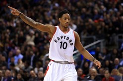 DeMar DeRozan of the Toronto Raptors signals to teammates during the first half of an NBA game against the Cleveland Cavaliers at Air Canada Centre on December 5, 2016 in Toronto, Canada. 