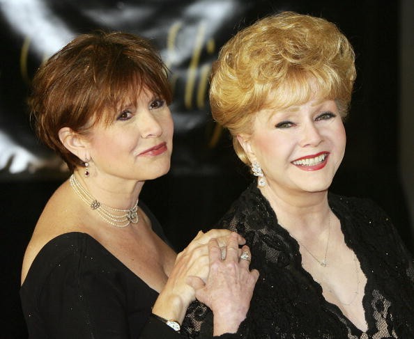 Actress Carrie Fisher (L) and her mother, actress Debbie Reynolds, arrive for Dame Elizabeth Taylor's 75th birthday party at the Ritz-Carlton, Lake Las Vegas on February 27, 2007 in Henderson, Nevada. 