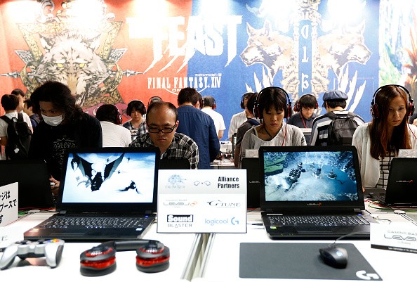 Visitors play the Final Fantasy XIV in the Square Enix Co. booth at Tokyo Game Show on September 17, 2016 in Chiba, Japan.