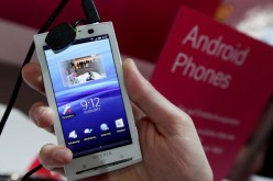 A stand host holds a Sony Ericsson XPERIA X10 mobile phone that uses the Android operating system