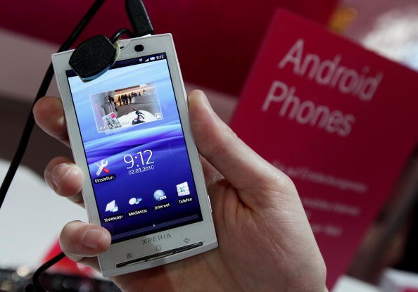A stand host holds a Sony Ericsson XPERIA X10 mobile phone that uses the Android operating system