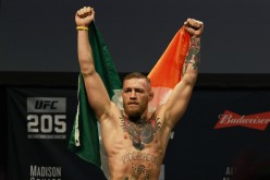 UFC Featherweight Champion Conor McGregor reacts as he walks on stage for UFC 205 Weigh-ins at Madison Square Garden on November 11, 2016 in New York City. 