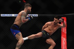 Dominick Cruz lands a leg kick against Cody Garbrandt in their encounter at UFC 2017 last Dec. 30, 2016.