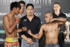 Khim Dhima (L) and Rene Catalan (R) square off during the weigh-ins for ONE: Total Domination last Oct. 17, 2013.