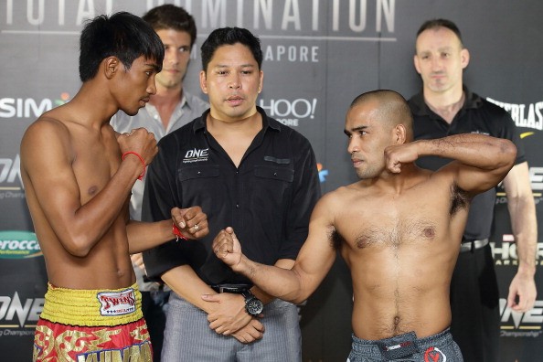 Khim Dhima (L) and Rene Catalan (R) square off during the weigh-ins for ONE: Total Domination last Oct. 17, 2013.