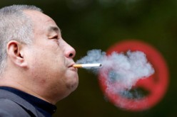 A-man-smokes-next-to-a-No-007.jpg