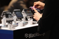 Visitors try out Blackberry smartphones at the Blackberry stand on the first day of the CeBIT 2012 technology trade fair on March 6, 2012 in Hanover, Germany. 