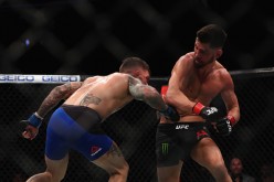 Cody Garbrandt lands a huge body shot against Dominick Cruz at UFC 207 last Dec. 30, 2016.