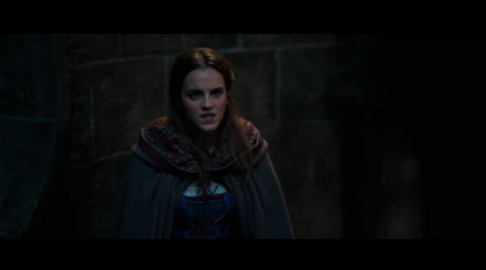 Belle, played by Emma Watson, asks the Beast to show himself in the "Beauty and the Beast" trailer.