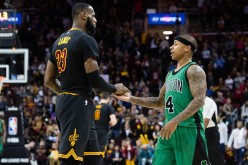  LeBron James of the Cleveland Cavaliers celebrates with Isaiah Thomas of the Boston Celtics during the final seconds second half at Quicken Loans Arena on December 29, 2016 in Cleveland, Ohio. 