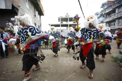 Performers dancing the Tashi Sholpa, a Tibetan opera dance for good luck.