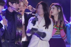 BTS' V and Red Velvet's Joy caught staring at each other on stage during a recent year-end event.