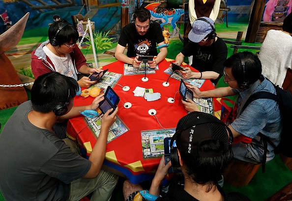 Gamers play "Monster Hunter Stories" on their Nintendo 3DS consoles during the Tokyo Game Show last Sep. 17, 2016.