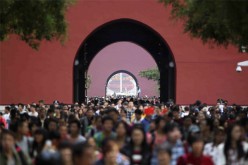 Tourists flock around Tiananmen Square in Beijing in this file photo.