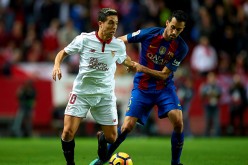 Samir Nasri (L) battles for the ball against Sergio Busquets (R) in the game between Sevilla and Barcelona in the Liga Santander last Nov. 6, 2016.