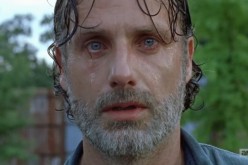 Rick sheds tears as he watches Negan and his group move out of Alexandria in 