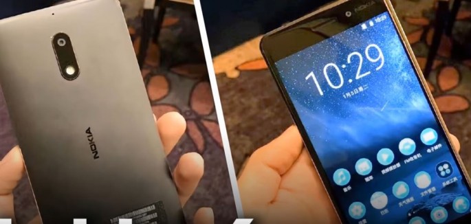 A front and back features of Nokia 6 is being showcased while it rests on a palm.