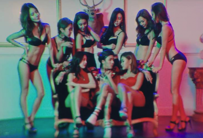 Ravi surrounded by lingerie-clad women in the controversial scene from the MV of his recent release, "Bomb."