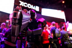 A person dressed as a solider from the X-COM 2 video game poses for a picture during the E3 Electronic Entertainment Expo in Los Angeles, California, U.S., on Tuesday, June 16, 2015.