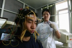 A young Chinese Internet addict receives an electroencephalogram check at the Beijing Military Region Central Hospital.