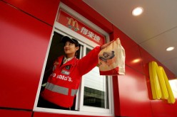 A new McDonald's drive-thru facility opens in Beijing.